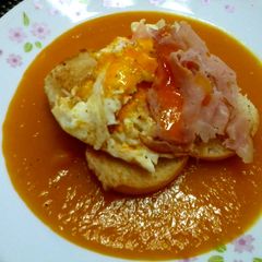 A picture of Fried Egg And Ham On Pumpkin Soup.