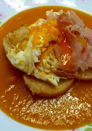 A picture of Fried Egg And Ham On Pumpkin Soup.