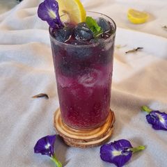 A picture of Blue pea magic layered mocktail.
