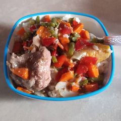 A picture of Rice with chicken sauce.
