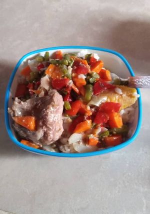 A picture of Rice with chicken sauce.