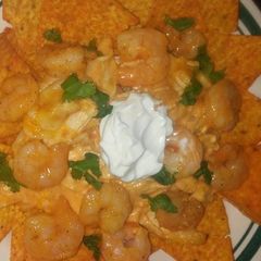 A picture of Buffalo chicken and shrimp nachos.
