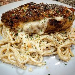 A picture of Mozzarella Stuffed Chicken with Spaghetti in Cream Sauce.