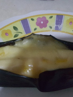 Una foto de Plátano maduro horneado relleno de jamón y queso