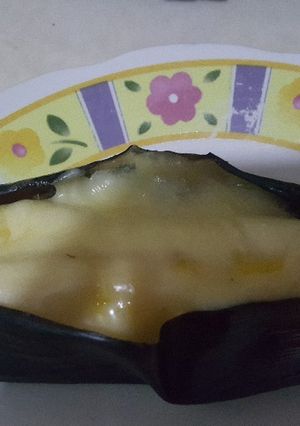 Una foto de Plátano maduro horneado relleno de jamón y queso