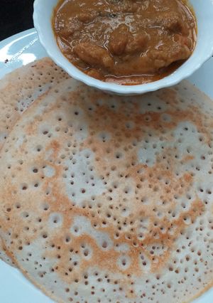 A picture of Dosa With Chicken Curry.