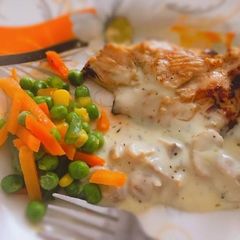 A picture of Grilled chicken with mushroom sauce and stir fry veggies.