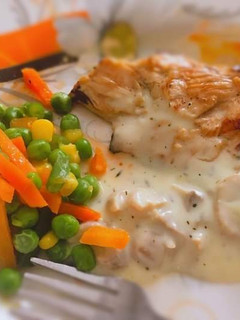 A picture of Grilled chicken with mushroom sauce and stir fry veggies.