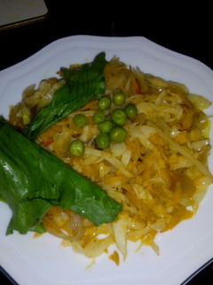 A picture of Fried cabbage with carrots.