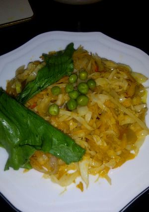 A picture of Fried cabbage with carrots.