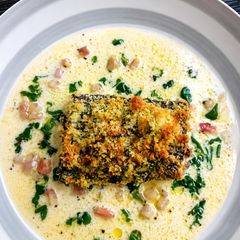 A picture of Herb-Crusted Hake with Light Lemon Basil Cream Sauce.