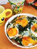 Baked eggs on seasonal greens and prosciutto