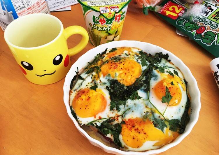 Baked eggs on seasonal greens and prosciutto Baked eggs on seasonal greens and prosciutto