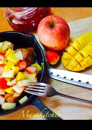 A picture of French toast with fruits.
