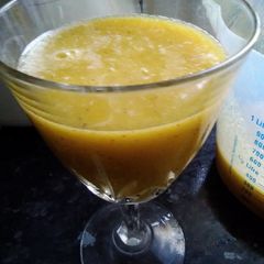 A picture of Fresh #oranges #kiwifruit and #rootginger #smoothie.