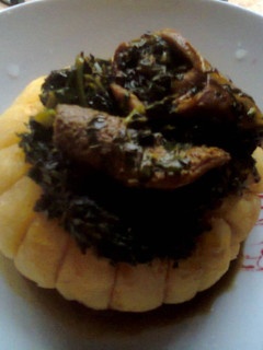 A picture of Eba and Vegetable Soup.