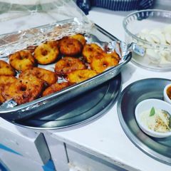 A picture of Hashtag#cc2022#week 3#snack #Onion vada coconut chutney.