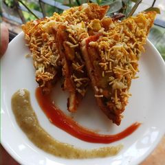 A picture of Masala cheese and corn toast.
