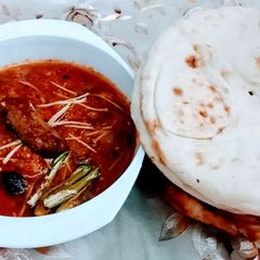 A picture of Seekh kabab karhai.