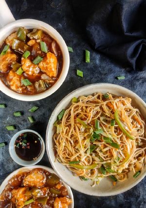 A picture of Veg noodles with chicken Manchurian.
