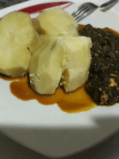 A picture of Boiled potatoes with vegetable sauce.