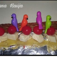 A picture of Cheese Cherry Pineapple On a Stick🍒🍍.
