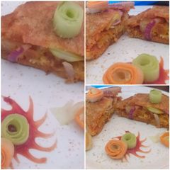 A picture of Carrot stuffed cheesy noodle tikki sandwich.