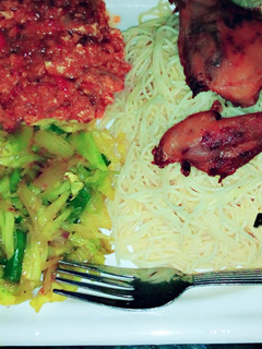 A picture of White spaghetti, egg stew,steamed cabbage and fried chicken.