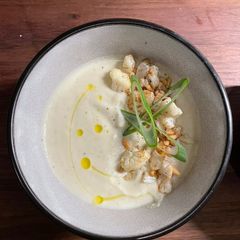 A picture of Cauliflower soup with roasted garlic.