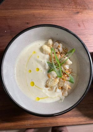 A picture of Cauliflower soup with roasted garlic.