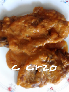 Una foto de Chuleta de cerdo con salsa de tomate