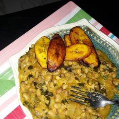 A picture of Porriage beans with fried plantain and scent leaf.