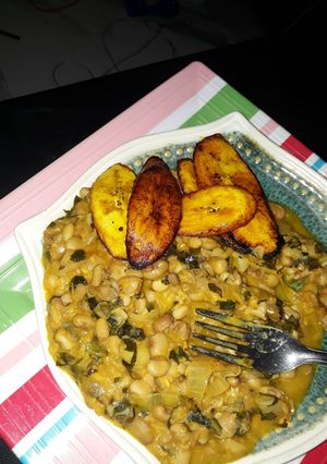 A picture of Porriage beans with fried plantain and scent leaf.