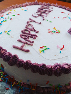 A picture of Strawberry cake with whipping cream decoration.