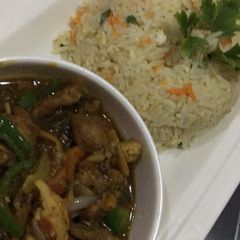 A picture of Chinese rice with shredded chicken sauce.