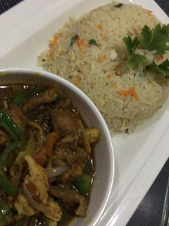 A picture of Chinese rice with shredded chicken sauce.