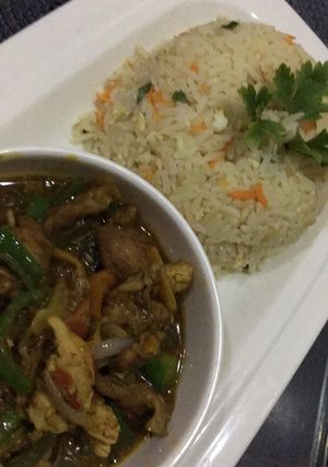 A picture of Chinese rice with shredded chicken sauce.