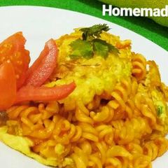 A picture of Fusilli Omellete with Tomato Sauce.