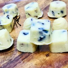 A picture of Homemade white chocolate with dry fruits & cranberries.