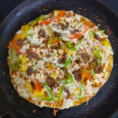 A picture of Paneer Tikka Pizza.