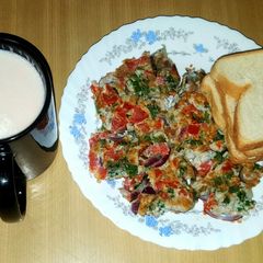 A picture of Breakfast spanish omelette with bread.