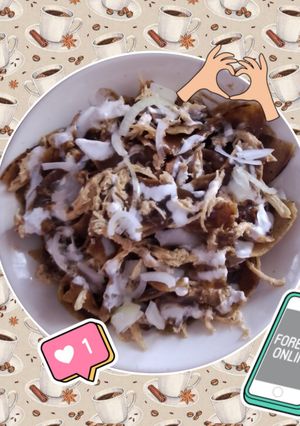 Una foto de Chilaquiles de Mole 🫕