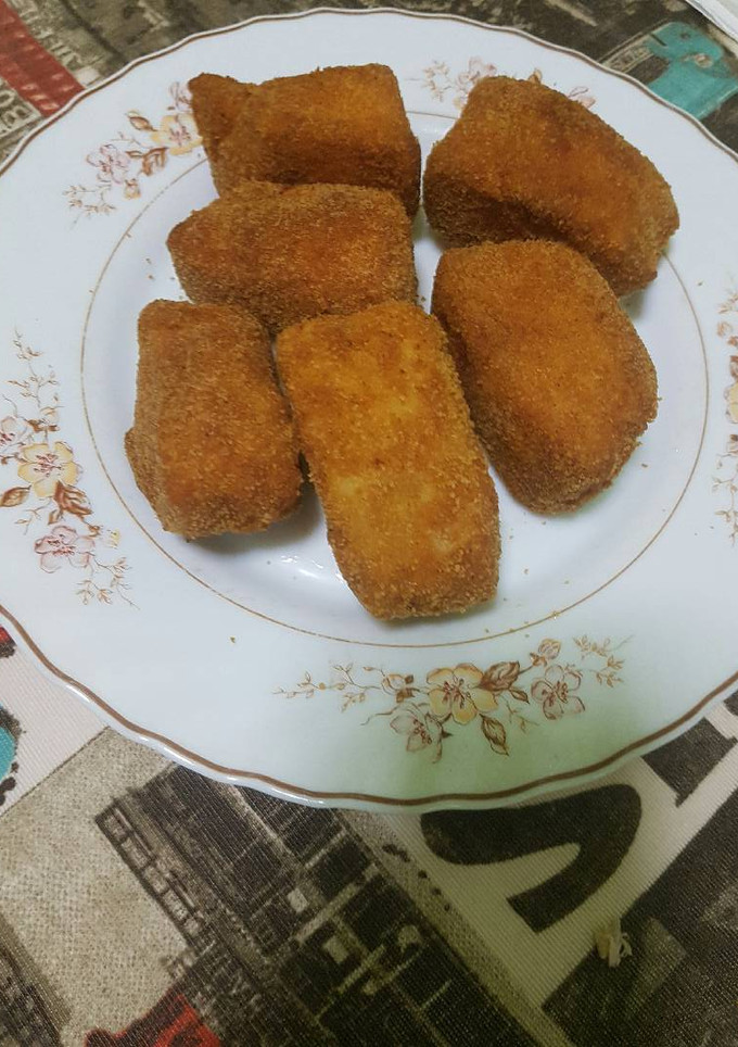 Una foto de Pescado empanado. Atún