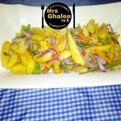 A picture of Fried chips with veggies.
