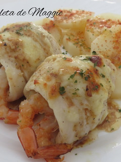 Una foto de Rollitos de merluza con gambas en salsa de limón