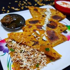 A picture of Toor dal paratha with paneer masala stuffing.