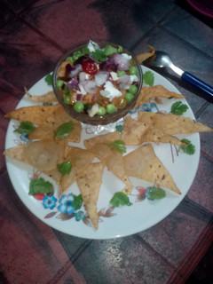 A picture of Roasted tomato with fruit salsa.