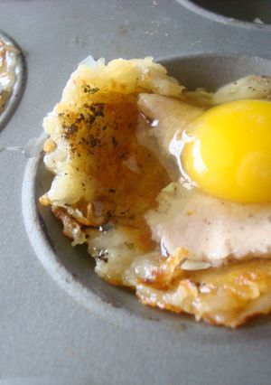 A picture of Baked eggs in shredded potato cheese cups.
