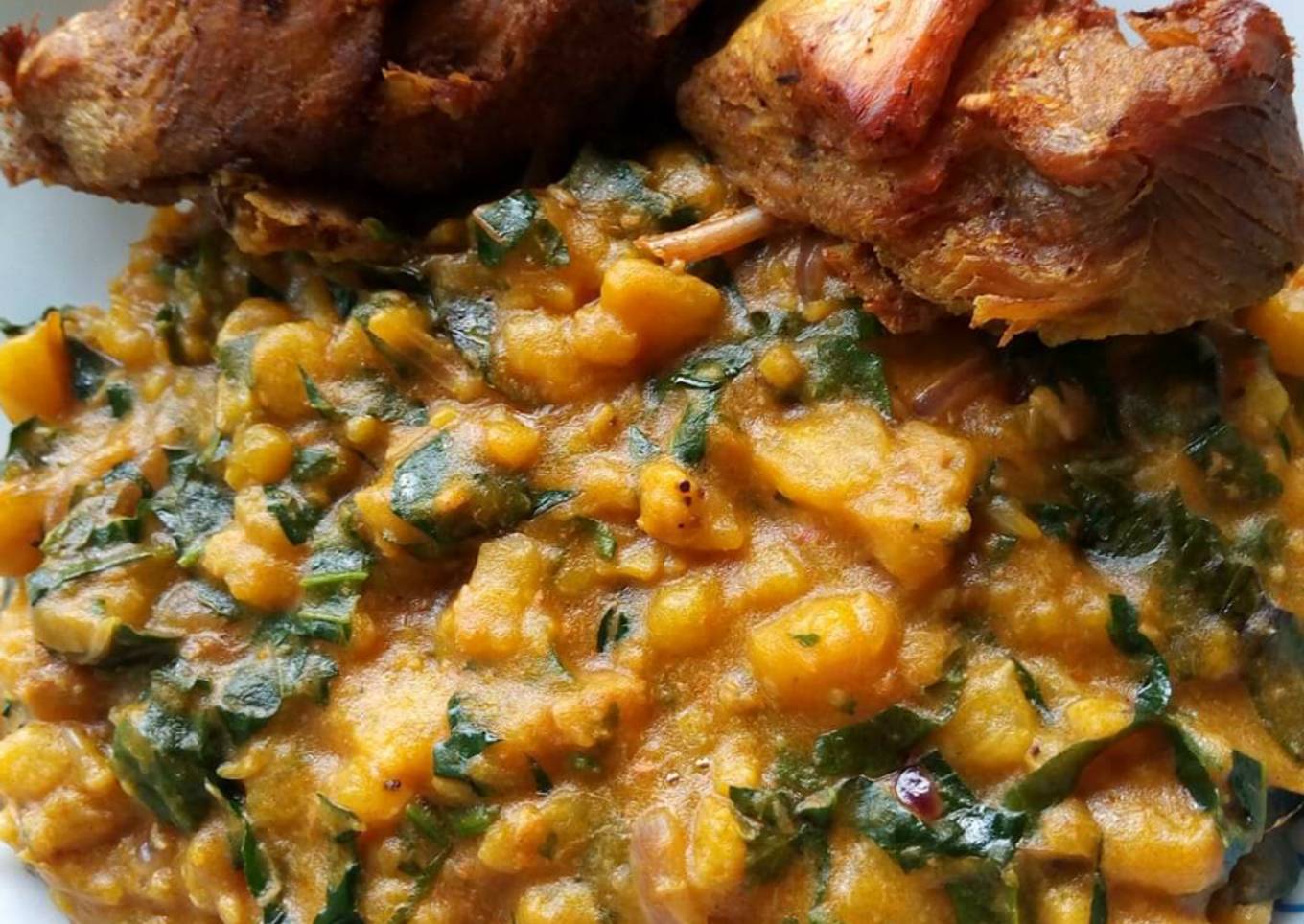 Unripe plantain porriage with fried chicken