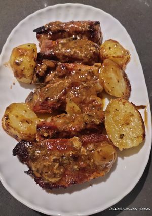 A picture of Baked Ribs with Potatoes.